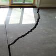 a huge crack in a concrete slab floor in Laconia