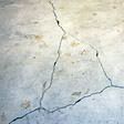 foundation heaving cracks in a slab floor in Essex Junction