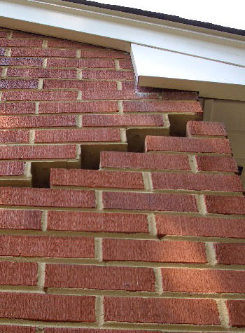 photo of a rotating foundation wall with cracks in Newport