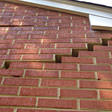stair step cracking on a foundation wall in Keene