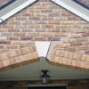 Major tuckpointing on a home archway over a door, with tuckpointing several inches wide that has failed on a Burlington home