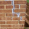 Tuckpointing that cracked due to foundation settlement of a Keene home