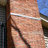 A tilting chimney on a Swanton home with a leaning, tilting chimney that was temporarily repaired.
