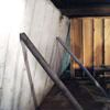 Temporary foundation wall supports stabilizing a Essex Junction home