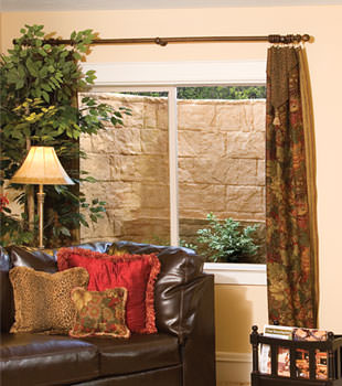 Our durable plastic window well installed in a finished basement in Barre.