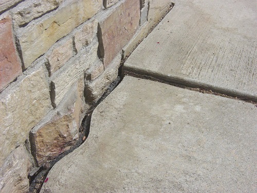 Sinking concrete sidewalk