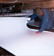 Plattsburgh, NY insulation being installed in a crawl space.