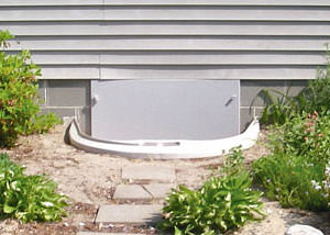 Rigid plastic crawl space access well installed in a Keene crawl space