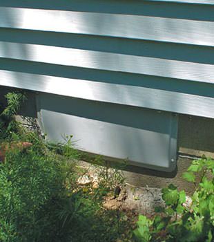 A gray crawl space vent cover in Claremont