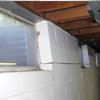 A foundation showing severe inward buckling along the windows in a Lebanon home.