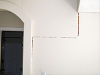 Drywall cracking due to foundation settlement in Suncook
