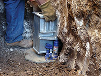 Securing a foundation footing bracket for a foundation repair system in St. Albans.