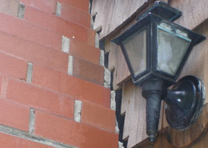 A tilting chimney in Claremont showing serious foundation damage.