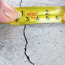 A crack in a poured concrete wall that's showing a normal crack during curing in Essex Junction