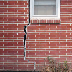 A foundation with a large crack that's wider at the top than on the bottom in Franklin
