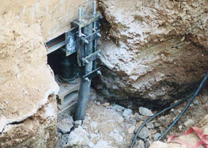 a bent, failed foundation push pier installed in Keene.