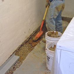 Digging a trench for a French Drain system in Burlington