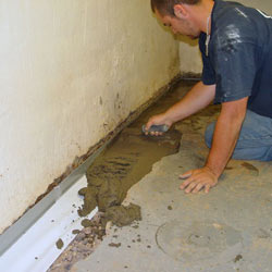 Testing a French drain system in a Brattleboro home.