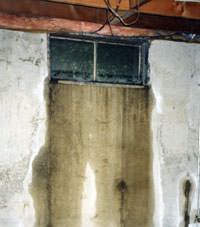Flooding through basement windows in a Essex Junction home.