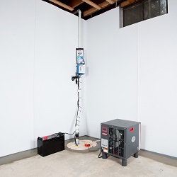 Sump pump system, dehumidifier, and basement wall panels installed during a sump pump installation in South Woodstock