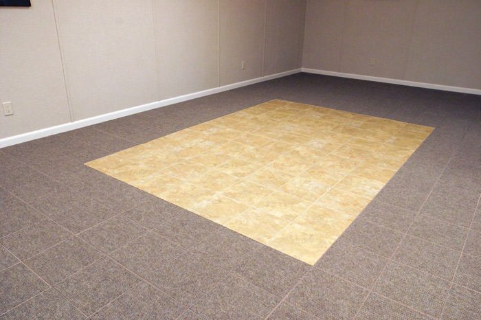 tiled and carpeted basement flooring installed in a Colchester home