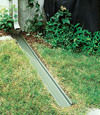 A recessed gutter drain extension installed in Essex Junction, Vermont and New Hampshire